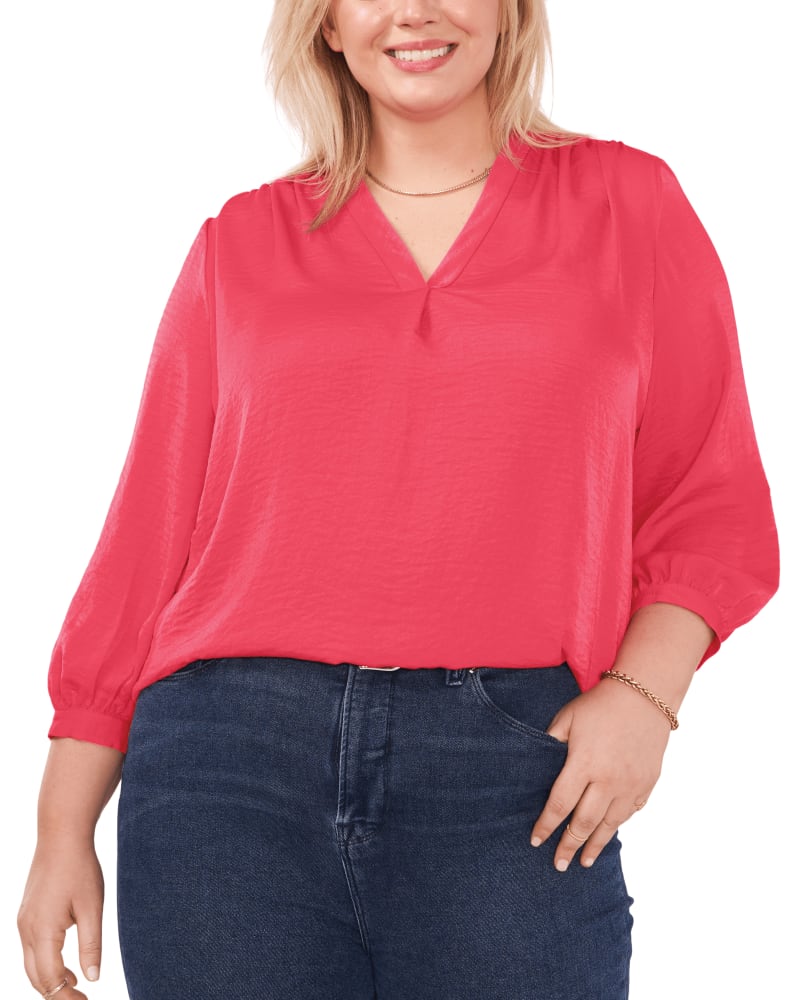 Front of a model wearing a size 1X Everley V-Neck Blouse in GERANIUM by Vince Camuto. | dia_product_style_image_id:261350